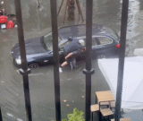 WATCH: ‘Real Sevillano hero’ rescues elderly man clinging to outside of his car as flood waters rise in city centre